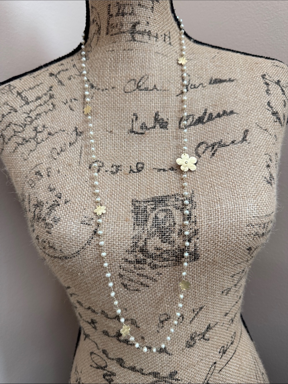 Yellow gold plated and rice pearl floral necklace.
